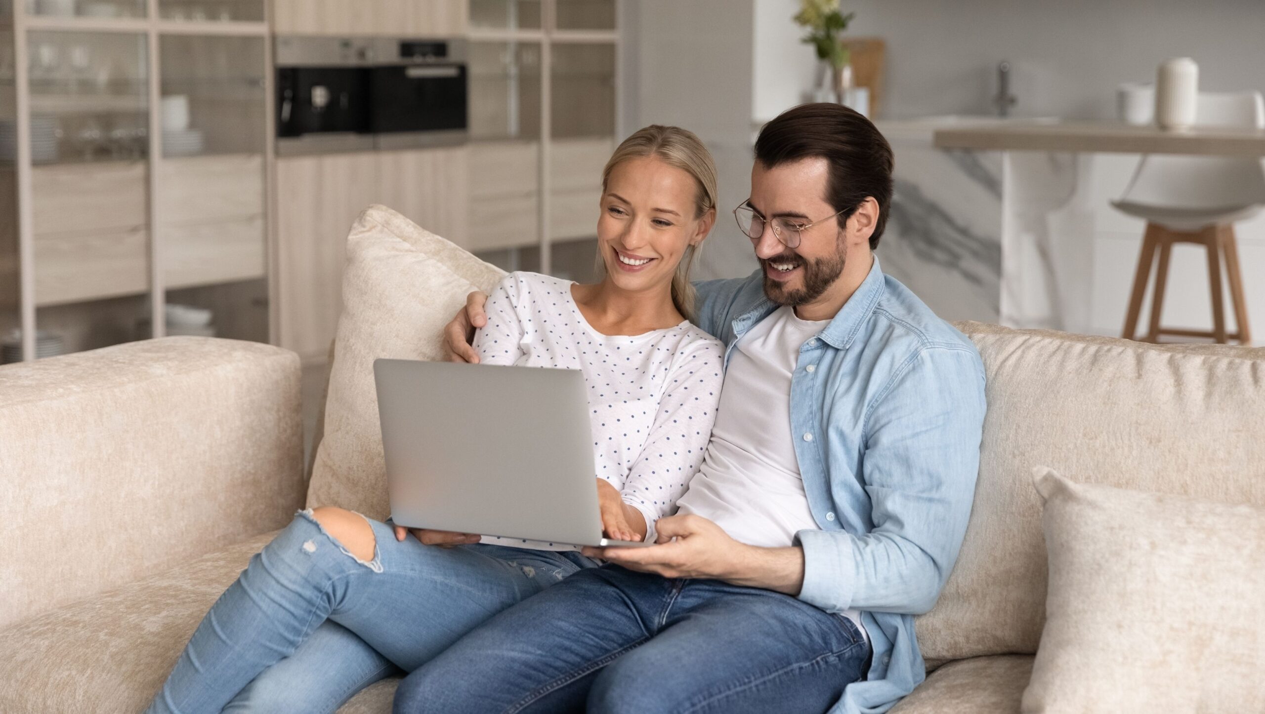 Happy couple on the computer