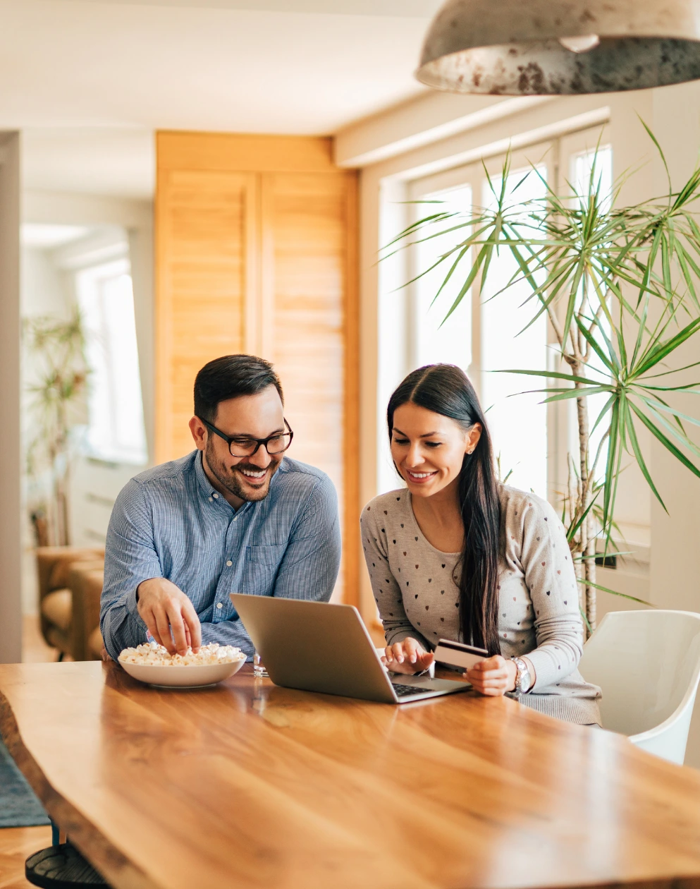 Couple using a computer for an online purchase